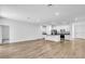 Spacious open-concept living area and kitchen with an island, stainless steel appliances, and lots of natural light at 5672 Jonesboro Ave, North Port, FL 34288