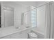 Bathroom featuring shower/tub combination and a well-lit vanity at 5821 Valente Pl, Sarasota, FL 34238