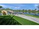 Picturesque community bridge over a tranquil lake with lush landscaping and inviting bench seating at 5821 Valente Pl, Sarasota, FL 34238