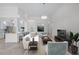 Bright and airy living room with soaring ceilings, neutral tones, and stylish furnishings at 5821 Valente Pl, Sarasota, FL 34238