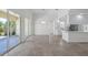 Open living area with sliding glass doors offering seamless indoor-outdoor living and abundant natural light at 5821 Valente Pl, Sarasota, FL 34238
