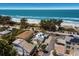 Stunning aerial shot of property with pool, conveniently located near beautiful beach and ocean at 601 Gulf S Dr, Bradenton Beach, FL 34217