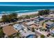 Real estate with great beach access and solar panels on neighboring home, offering a sustainable lifestyle at 601 Gulf S Dr, Bradenton Beach, FL 34217