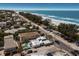 Breathtaking aerial view of coastal property featuring a pool, close beach access and stunning ocean views at 601 Gulf S Dr, Bradenton Beach, FL 34217