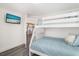 Charming bedroom with bunk beds and calming decor, perfect for a relaxing retreat after a day of fun activities at 601 Gulf S Dr, Bradenton Beach, FL 34217