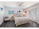Comfortable bedroom featuring nautical decor and access to the outdoor balcony at 601 Gulf S Dr, Bradenton Beach, FL 34217