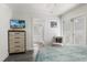 Nicely decorated bedroom featuring a wall-mounted television and ensuite bathroom access at 601 Gulf S Dr, Bradenton Beach, FL 34217