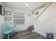 Bright entryway with staircase, blue bench, and decorative artwork at 601 Gulf S Dr, Bradenton Beach, FL 34217