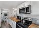 Bright kitchen featuring butcher block counters, stainless steel appliances, and subway tile backsplash for a modern, functional design at 601 Gulf S Dr, Bradenton Beach, FL 34217