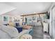 Cozy living room with dining area, beach-themed decor, and abundant natural light provides comfortable space at 601 Gulf S Dr, Bradenton Beach, FL 34217