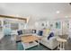 Inviting living room with a large sectional sofa and nautical-themed decor, creating a cozy and stylish space at 601 Gulf S Dr, Bradenton Beach, FL 34217