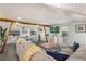 Open-concept living and dining area with wood beams, offering a cozy and inviting space for relaxation and entertainment at 601 Gulf S Dr, Bradenton Beach, FL 34217