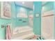 Bathroom featuring a tub, separate shower, and bright blue walls at 6106 New Paris Way, Ellenton, FL 34222