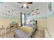Charming bedroom featuring a single bed, decorative wall art, and a cozy ambiance at 6106 New Paris Way, Ellenton, FL 34222