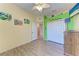Bedroom with light walls, laminate flooring, closet, and exterior views at 6106 New Paris Way, Ellenton, FL 34222