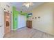 Spacious bedroom with wood-look floors, closet, and en suite laundry access at 6106 New Paris Way, Ellenton, FL 34222