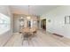 Bright dining area featuring wood floors and a modern chandelier at 6106 New Paris Way, Ellenton, FL 34222