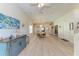Open living room with wood floors, stylish decor, and lots of natural light at 6106 New Paris Way, Ellenton, FL 34222