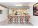 Open floor plan features a living room with bar seating separating it from the kitchen and dining area at 6106 New Paris Way, Ellenton, FL 34222