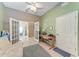 Office with natural light, desk, and access to the dining room through glass doors at 6106 New Paris Way, Ellenton, FL 34222