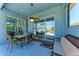 Enjoy this covered patio with a ceiling fan and sliding glass doors to the pool at 6106 New Paris Way, Ellenton, FL 34222
