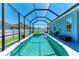 Sparkling pool with attached hot tub in a screened enclosure offers the best backyard relaxation at 6106 New Paris Way, Ellenton, FL 34222