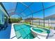 Heated pool and spa within a screened lanai, perfect for relaxation and outdoor entertaining at 6106 New Paris Way, Ellenton, FL 34222