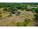 Expansive lot featuring a unique barndominium, a blend of barn and modern living, set amid lush greenery and mature palms at 6321 279Th E St, Myakka City, FL 34251