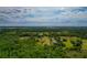 Expansive aerial image of a property featuring lush greenery, open fields, and serene living, blending nature and comfort at 6321 279Th E St, Myakka City, FL 34251