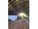 Interior of the metal barn featuring a dirt floor and plenty of open space ready for customizations at 6321 279Th E St, Myakka City, FL 34251
