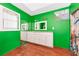 Bright bathroom with double sinks, white cabinetry, and a turtle themed shower curtain at 6321 279Th E St, Myakka City, FL 34251
