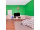 Relaxing bedroom setup with hard wood floors, featuring a TV and chair creating a cozy space to unwind at 6321 279Th E St, Myakka City, FL 34251