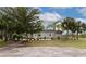 Exterior features include a modest home with palm trees and a stone outdoor cooking space at 6321 279Th E St, Myakka City, FL 34251