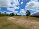 Expansive lot featuring mature landscaping, trees, and a building perfect for your future dream home at 6321 279Th E St, Myakka City, FL 34251