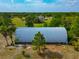 Quonset hut surrounded by mature trees offers plenty of dry storage space at 6321 279Th E St, Myakka City, FL 34251