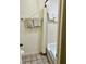 Bright bathroom with a shower/tub combo and neutral colored tiles at 6368 Draw Ln # 34, Sarasota, FL 34238