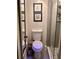 Neat bathroom featuring a glass door shower and simple wallpaper at 6368 Draw Ln # 34, Sarasota, FL 34238