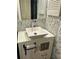 Stylish bathroom featuring a modern vessel sink and elegant wallpaper at 6368 Draw Ln # 34, Sarasota, FL 34238