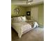 Cozy bedroom featuring neutral tones, tiled flooring, and ample natural light at 6368 Draw Ln # 34, Sarasota, FL 34238