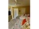 Bright bedroom with tiled floors, two beds, and overhead ceiling fan at 6368 Draw Ln # 34, Sarasota, FL 34238