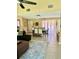 Open dining area with sliding glass doors to patio, adjacent to living room at 6368 Draw Ln # 34, Sarasota, FL 34238