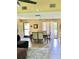 Open dining area with sliding glass doors to patio, adjacent to living room at 6368 Draw Ln # 34, Sarasota, FL 34238