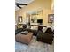 Inviting living area with a comfortable sectional, decorative mirrors, and neutral color scheme at 6368 Draw Ln # 34, Sarasota, FL 34238