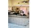 Comfortable living room with large sofa and view into dining area at 6368 Draw Ln # 34, Sarasota, FL 34238