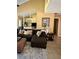 Stylish living room with an oversized couch, decorative pillows, and a sleek ceiling fan at 6368 Draw Ln # 34, Sarasota, FL 34238