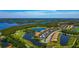 Overhead view of a beautiful community surrounded by water, golf course and mangroves at 6406 Grand Estuary Trl # 102, Bradenton, FL 34212