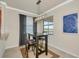 Breakfast nook featuring an industrial light fixture, small table, and a picturesque window view at 6406 Grand Estuary Trl # 102, Bradenton, FL 34212