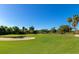 Expansive golf course featuring lush green fairways, a sand trap, and mature trees at 6406 Grand Estuary Trl # 102, Bradenton, FL 34212