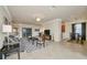 An open concept living room featuring a ceiling fan, neutral walls, and tile flooring throughout at 6406 Grand Estuary Trl # 102, Bradenton, FL 34212