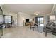 Open-concept living room featuring tile floors, neutral walls, and sliding glass doors to the outside at 6406 Grand Estuary Trl # 102, Bradenton, FL 34212